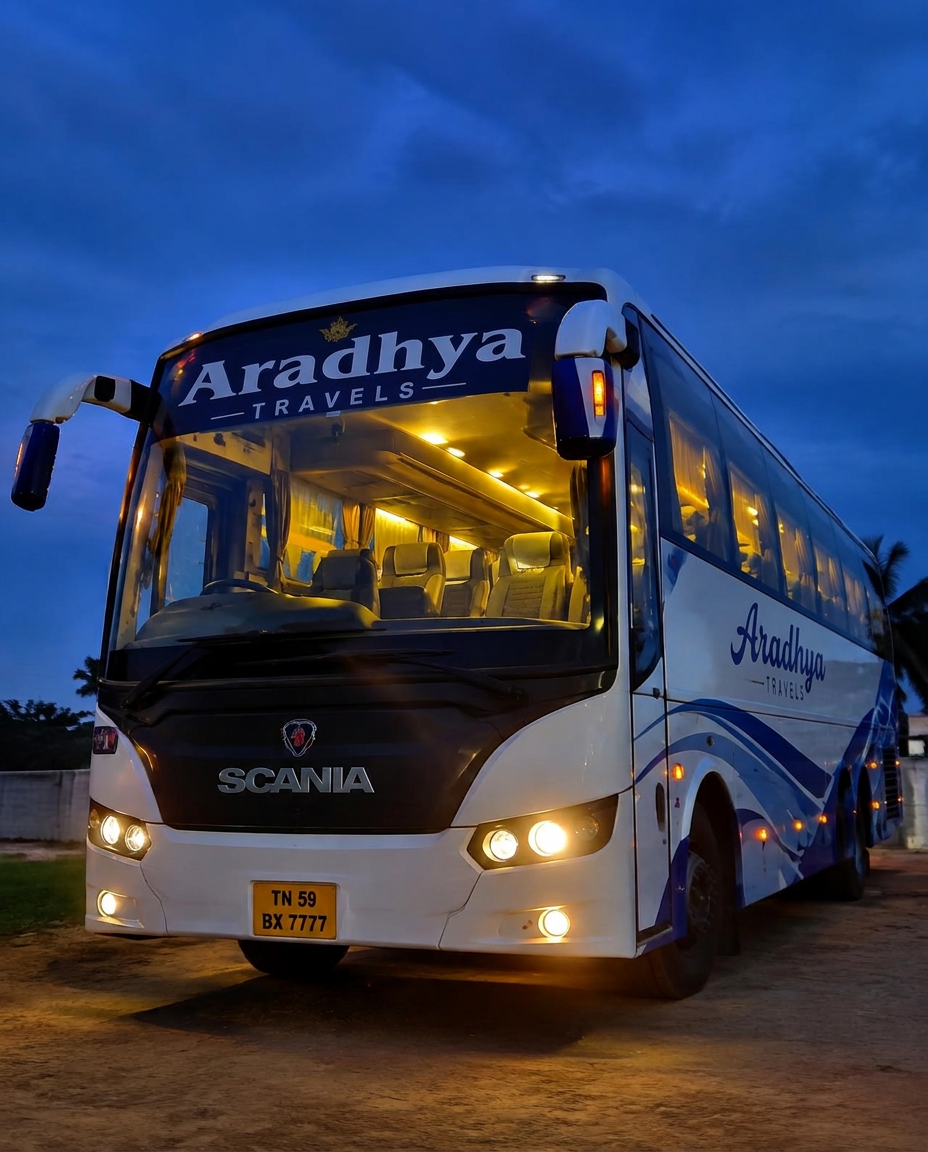 Tourist bus parked with headlights on at dusk